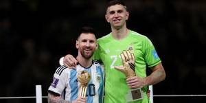 Emiliano Martínez and Lionel Messi at the award ceremony after Argentina’s World Cup win in 2022.