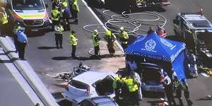 One person is dead after a bus and three cars collided on Sydney Harbour Bridge.