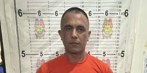 Gregor Johann Haas poses for a mugshot following his arrest in Cebu province.