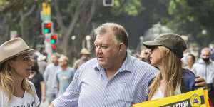 Craig Kelly,centre,at a “freedom” rally in Sydney on November 20.