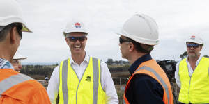 Roads Minister John Graham tours the M12 construction site on Thursday.