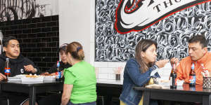 The Colombian-style hot dogs are served from a van (left) in the store