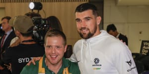 ‘Over the moon’:Socceroos arrive home with smiles – and Messi’s jersey