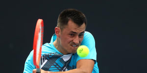 ‘It’s good to be back’:Tomic advances after injured opponent retires