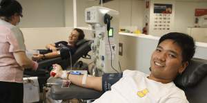 Parvit Kulsiithana gives blood at the Town Hall Lifeblood clinic in Sydney on Monday.