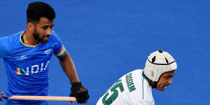 India’s captain Manpreet Singh keeps a close eye on South Africa’s Dayaan Cassiem during Saturday’s semi-final.