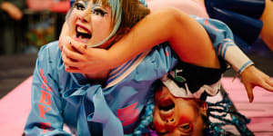 Baby Face and Saki Bimi wrestling during a Sukeban match,a unique form of Japanese wrestling that mixes fashion and theatrics.