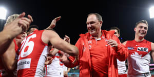 Sydney players showed their respect for coach John Longmire after a narrow win in his 300th game as coach.