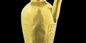 A gold spouted heset vase with inscribed cartouches of Ahmose I. 
