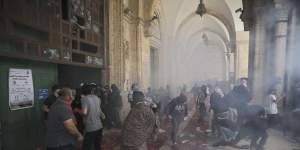 Palestinians clash with Israeli security forces at the al-Aqsa Mosque compound on Monday.