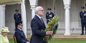 High Commissioner George Brandis lays a wreath at the socially distanced anniversary service. 