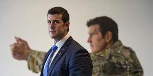 Ben Roberts-Smith in front of his portrait at the Australian War Memorial in Canberra.