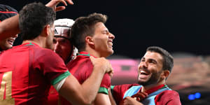 Portugal celebrate their first World Cup win.