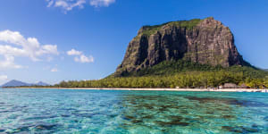 The imposing Le Morne mountain sits on the edge of the beach.