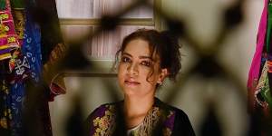 Lida Mangal wearing Afghan garments she has designed.