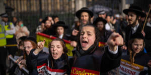 Anti-Zionist Orthodox Jewish children shout and gesture at pro-Israel supporters during a march to mark Al Quds Day and show solidarity with Palestinians in London,on April 5. Al Quds Day is celebrated worldwide on the last Friday of the holy month of Ramadan to show support for the Palestinians.