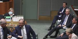 The Prime Minister and Opposition Leader Anthony Albanese elbow bump after delivering end-of-year statements to the House of Representatives in December.
