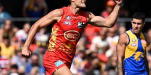 Gold Coast’s Jarrod Witts shows his delight after scoring a goal against the Eagles. 