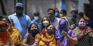 Distraught women outside a hospital where coronavirus cases and deaths are increasing,in New Delhi.