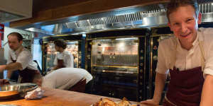 Chef Ben Greeno is on display in the open kitchen,along with his Rotisol rotisseries.