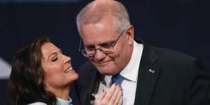 Outgoing Prime Minister Scott Morrison is embraced by his wife,Jenny,after conceding defeat.