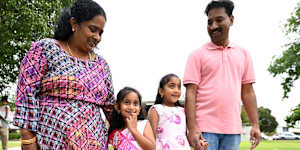 Tharnicaa Nadesalingam (2nd left) arrives for her fifth birthday party with her parents Priya and Nades and sister Kopika after their safe return to Biloela.