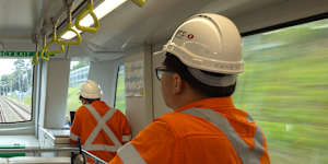 Metro staff oversee the trip from Bankstown to Marrickville on Monday.