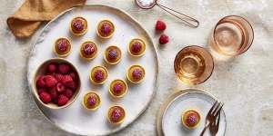 Fill store-bought mini tart shells with lemon curd and decorate with fresh raspberries for a simple sweet.