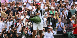 Nick Kyrgios broke the Wimbledon dress code rules by wearing a red cap and shoes on the court.