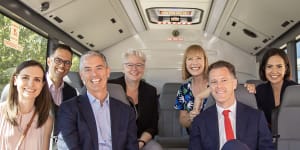 Chris Minns on his campaign bus with Labor colleagues (from left) Courtney Houssos,Daniel Mookhey,John Graham,Penny Sharpe,Jo Hayden,and deputy leader Prue Car last Sunday.