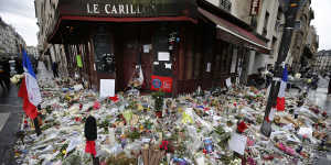 Flowers and candle tributes outside the Restaurant Le Carillon in Paris,after the November 13 attacks.