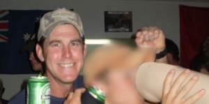 Ben Roberts-Smith (left) with a former colleague drinking from the prosthetic leg of a dead Afghan man in 2012.