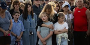 Families gather at Dover Heights in Sydney on Wednesday night for a Jewish vigil supporting Israel.