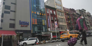 The glass facade building,second from left,is believed to be the site of a foreign police outpost for China in New York’s Chinatown.