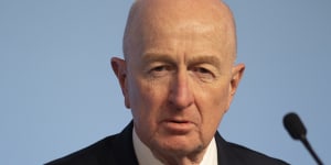 Macquarie chair Glenn Stevens warns on inflation as profits take a hit