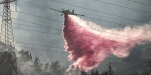 Israeli firefighters extinguish blazes in northern Israel caused by Hezbollah rockets in July.