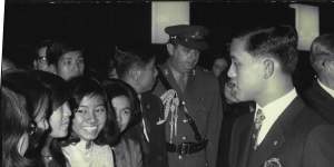 Thailand's Crown Prince talks briefly with a welcoming group of Thai students on his arrival at Sydney Airport in September 1970. 