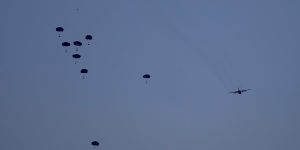 Humanitarian aid is dropped by the United States over Gaza City.