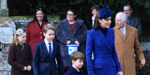 The Duchess of Cambridge with her son,Louis,following the Christmas Day church service at Sandringham. 