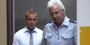 One-punch killer Kieran Loveridge is escorted from the NSW Supreme Court in November 2013.