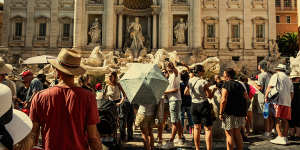 Tourists at the Trevi Fountain in Rome in July 2024.