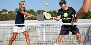 Julie Campbell and Mark Taylor play pickleball in Melbourne. The shrunken version of tennis,which also includes elements of badminton and ping pong,is the fastest growing sport in the US and rapidly on the rise in Australia. 