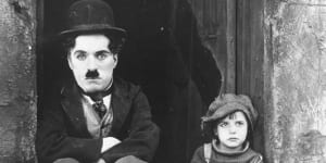 Charlie Chaplin and Jackie Coogan in his 1921 film The Kid.