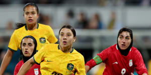 Mary Fowler and Samantha Kerr prepare for a corner kick during the Matildas’ Olympic qualifier match against Iran.