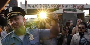 Minneapolis Police Chief Brian O’Hara raises his fist in solidarity