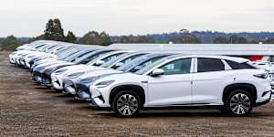 Imported BYD electric vehicles parked in a storage yard in Melbourne in 2025.