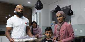 Ismaeel Ahmad (centre front) and his father Usman (left),mother Javeria (right) and sister Rumaysa (back) at their Merrylands home.