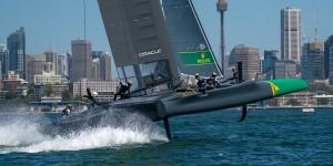 The Australian SailGP Team F50,skippered by Tom Slingsby,flies across Sydney Harbour in 2019. 