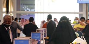 Saudi passengers enter King Abdulaziz International Airport in Jiddah,Saudi Arabia,where vaccinated citizens are allowed to leave the kingdom for the first time in more than a year.