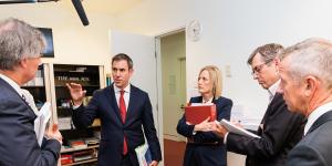 Treasurer Jim Chalmers and Finance Minister Katy Gallagher visit The Sydney Morning Herald office during the budget lock-up.